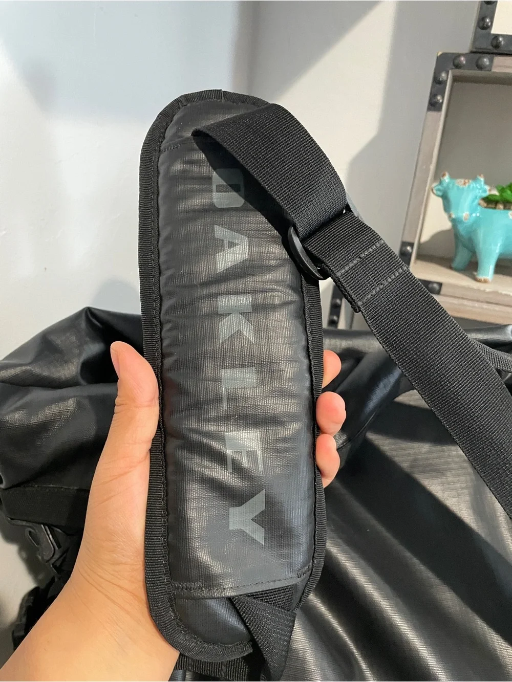 Oakley Motion 42 canvas bag in black features a waterproof roll-top design.